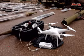 Vũ khí và máy bay trinh sát không người lái UAV, được thu giữ tại Daraa. Ảnh: SANA.