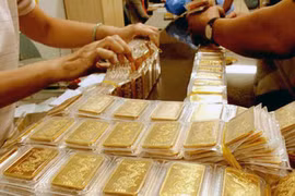 Lúc 13g30 ngày 13-8, giá vàng thế giới ở 1.121,7 USD/ounce