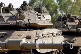 Xe tăng Merkava của Israel hoạt động trên Cao nguyên Golan (Ảnh: AFP)