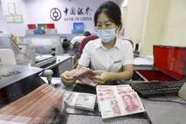 Từ ngày 25/10, nhiều ngân hàng Trung Quốc sẽ cùng nhau điều chỉnh giảm lãi suất vay thế chấp mua nhà thêm 0,3% (Ảnh: Yicai)