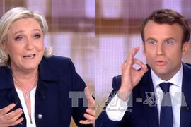 Ứng cử viên độc lập Emmanuel Macron (phải) và đối thủ Marine Le Pen. Ảnh: AFP/TTXVN