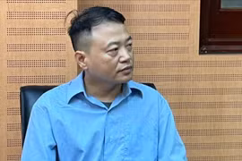 Shark Bình tại cơ quan điều tra.