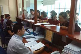Cán bộ thuế thỏa thuận hộ kinh doanh chia tiền thuế