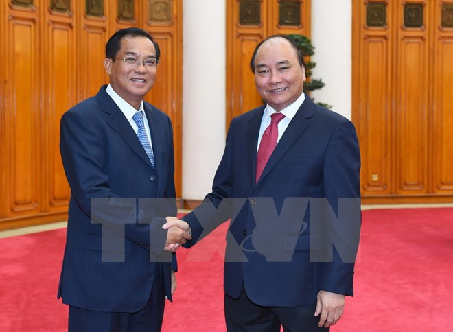 Thủ tướng Nguyễn Xuân Phúc tiếp ông Suphan Keomisay, Bộ trưởng Bộ Kế hoạch và Đầu tư Lào đang ở thăm và làm việc tại Việt Nam. (Ảnh: Thống Nhất/TTXVN).