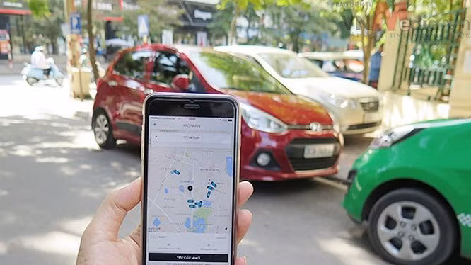 Các hãng taxi truyền thống cho rằng Grab và các hãng taxi công nghệ khác đang cạnh tranh thiếu lành mạnh, phá giá thị trường. Ảnh: Bộ Công thương