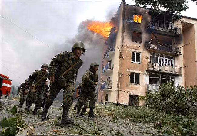 8.8.2008, khi tổng thống Putin đang tham dự khai mạc Olympic tại Bắc Kinh, Georgia đã triển khai hành động quân sự, tấn công vào khu vực ly khai Nam Ossetia. Ngay tại Bắc Kinh, ông Putin đã ra lệnh khai hỏa. Quân đội Nga đã tấn công các đơn vị Georgia tại Nam Ossetia rồi sau đó tiến sâu vào lãnh thổ nước này.