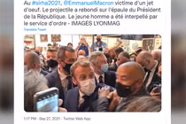 Tổng thống Pháp Emmanuel Macron bị ném vật thể lạ vào người tại một hội chợ ở Lyon (Ảnh: RT)