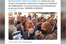 Tổng thống Pháp Emmanuel Macron bị ném vật thể lạ vào người tại một hội chợ ở Lyon (Ảnh: RT)