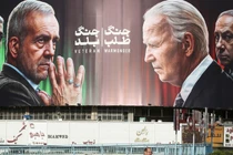 Biểu ngữ in hình Tổng thống Iran Pezeshkian và Tham mưu trưởng Baqeri đối diện với Tổng thống Mỹ Biden và Thủ tướng Israel Netanyahu, Tehran, ngày 28/10 (Ảnh: Getty)