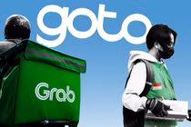 GoTo và Grab đã tích hợp nhiều dịch vụ vào một ứng dụng duy nhất (Ảnh: Bloomberg)