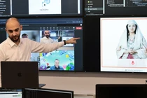 Các chuyên gia Albania làm việc tại Cơ quan Thông tin Xã hội Quốc gia với "Bộ trưởng" trí tuệ nhân tạo Diella, xuất hiện trên màn hình ở Tirana, Albania, ngày 12/9. Ảnh: NBC News.