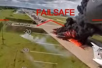 Ảnh cắt từ clip cho thấy UAV của Ukraine đang tấn công các máy bay ném bom chiến lược của Nga trong chiến dịch "Mạng nhện". Ảnh: WSJ. 