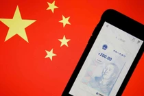 Việc mở rộng sử dụng đồng tiền số của Trung Quốc mang tới nhiều cơ hội, nhưng cũng không ít thách thức (Ảnh: Reuters)