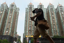 Khủng hoảng bất động sản ở Trung Quốc ảnh hưởng sâu rộng tới người mua nhà và các hộ gia đình (Ảnh: DW)