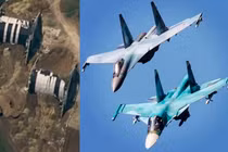 Nhà chứa máy bay của Nga và các chiến đấu cơ Su-34 và Su-35. Ảnh: MW.