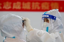 Các nhà khoa học Trung Quốc cho rằng COVID-19 xuất hiện ở Mỹ trước đợt dịch ở Vũ Hán (Ảnh: AFP)