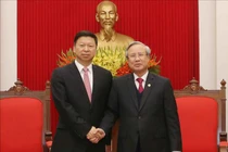 Ủy viên Bộ Chính trị, Thường trực Ban Bí thư Trần Quốc Vượng tiếp đồng chí Tống Đào, Ủy viên Trung ương Đảng, Trưởng Ban Liên lạc Đối ngoại Trung ương Đảng Cộng sản Trung Quốc. (Ảnh: Phương Hoa/TTXVN)