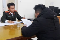 Phạm Kim Q làm việc tại cơ quan công an. Ảnh: Công an TP. Hải Phòng