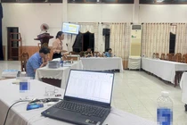 Quang cảnh buổi đấu giá mỏ cát ĐB2B ở xã Điện Thọ (Điện Bàn, Quảng Nam). Ảnh CTV.