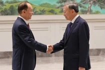 Tổng Bí thư, Chủ tịch nước Tô Lâm (bên phải) hội kiến Bí thư Tỉnh ủy Quảng Đông Hoàng Khôn Minh. Ảnh: TTXVN.