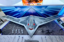 Chiếc UAV hạng nặng CH-7 và vũ khí trang bị cho nó được trưng bày (Ảnh: CCTV)