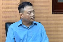 Shark Bình tại cơ quan điều tra.