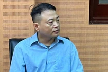 Shark Bình tại cơ quan điều tra.