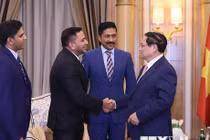 Thủ tướng Phạm Minh Chính tiếp ông Shehim Kottilingal, Giám đốc Tập đoàn Lulu quốc tế và các lãnh đạo tập đoàn. (Ảnh: Dương Giang/TTXVN)